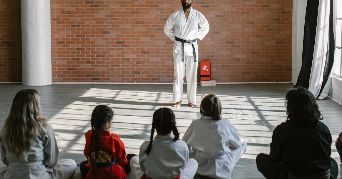 Children sitting attentively on the floor, listening to their instructor during a preschool Taekwondo focus training lesson.